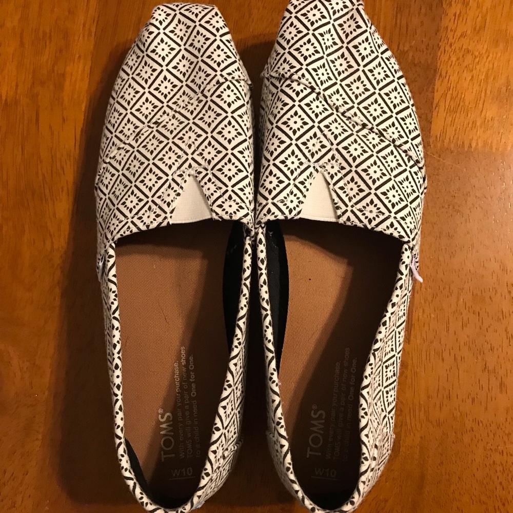Tom’s size 10 slip-ons